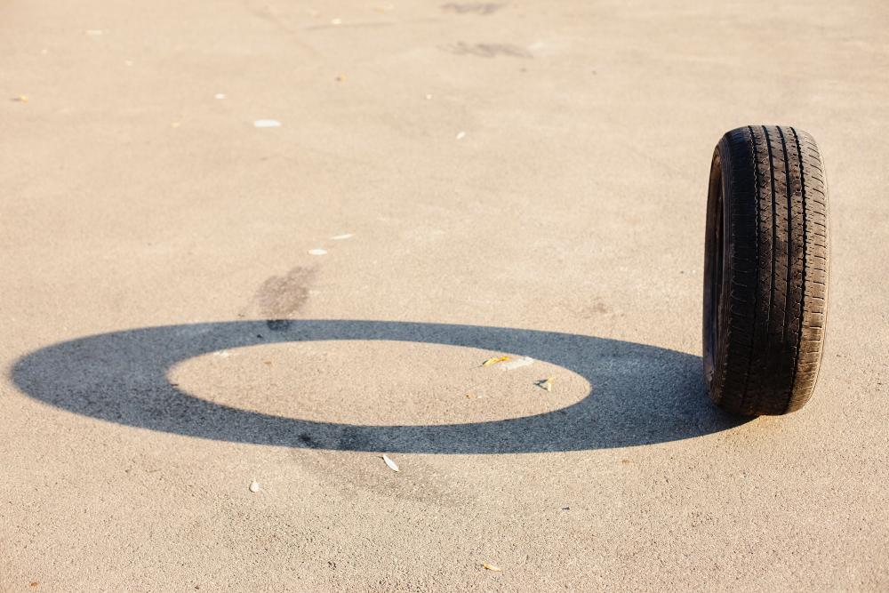 Tyre on sand Tyre on sand with a shadow